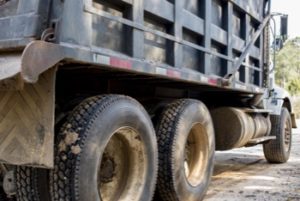 Family of Three Narrowly Avoids Injury as Dump Truck Slams into Home